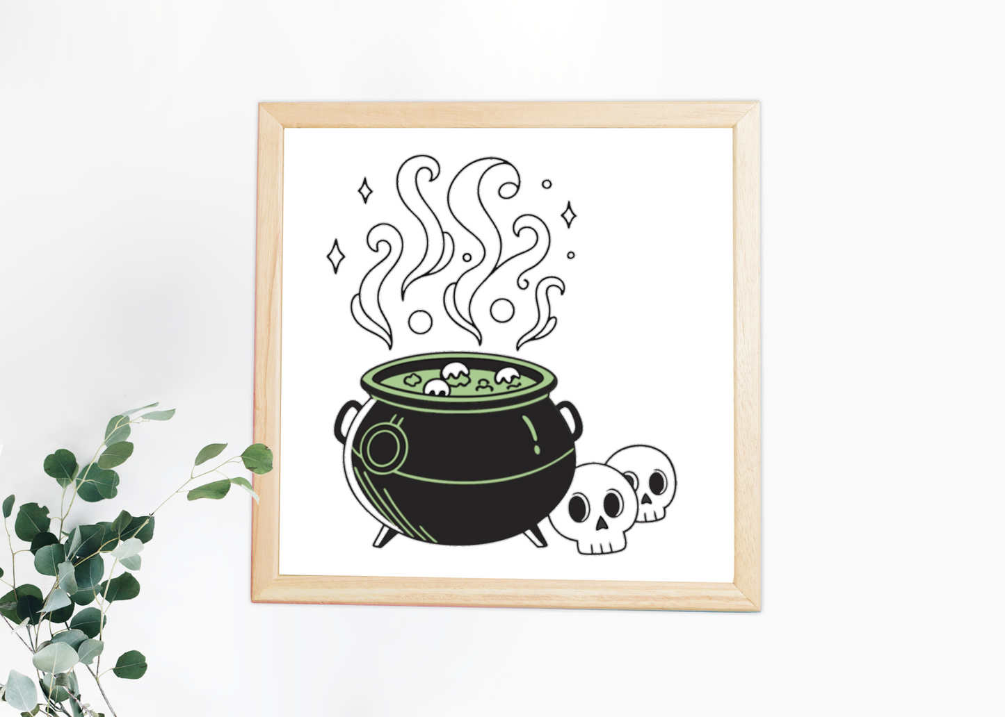 Cadre au design mystique avec chaudron bouillonnant dans une ambiance Halloween