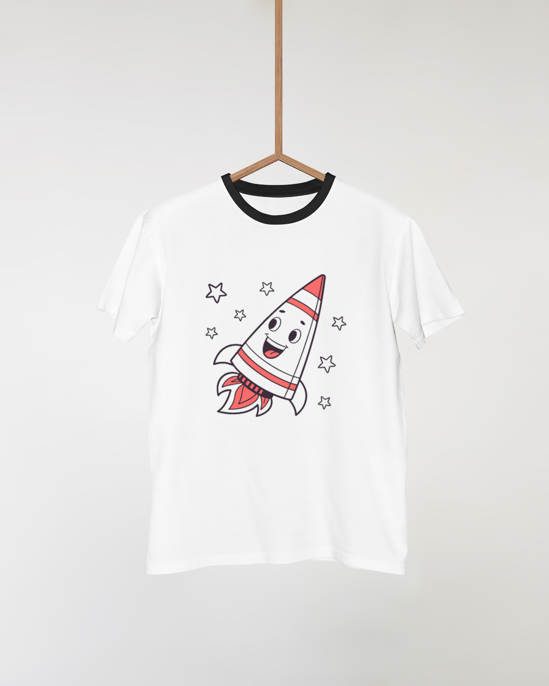 Motif fusée kawaii sur un t-shirt, idéal pour événements enfants