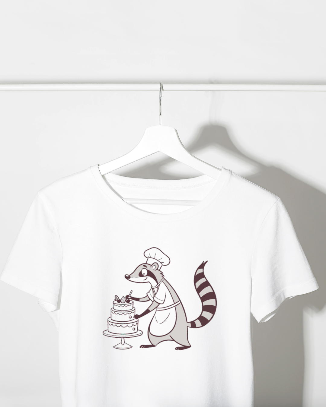 T-shirt avec raton laveur doodle joyeux cuisinant une pâtisserie kreative