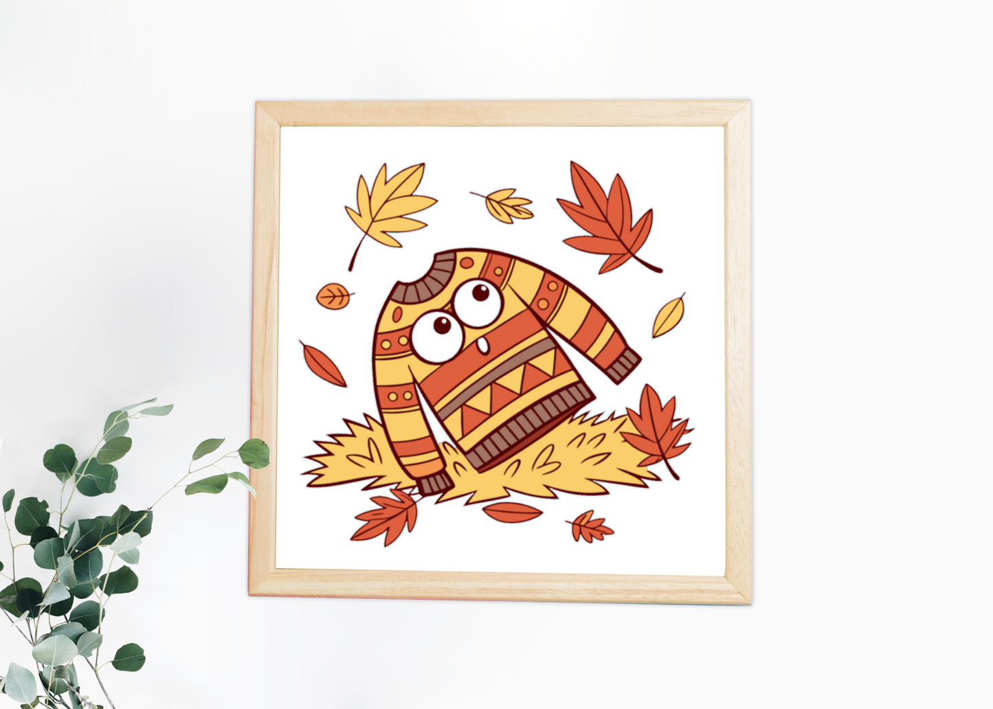 Cadre déco automne avec icône pull et feuilles volant doucement