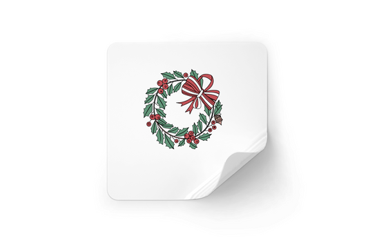 Sticker festif avec couronne de houx, parfait pour décorer vos cadeaux de Noël