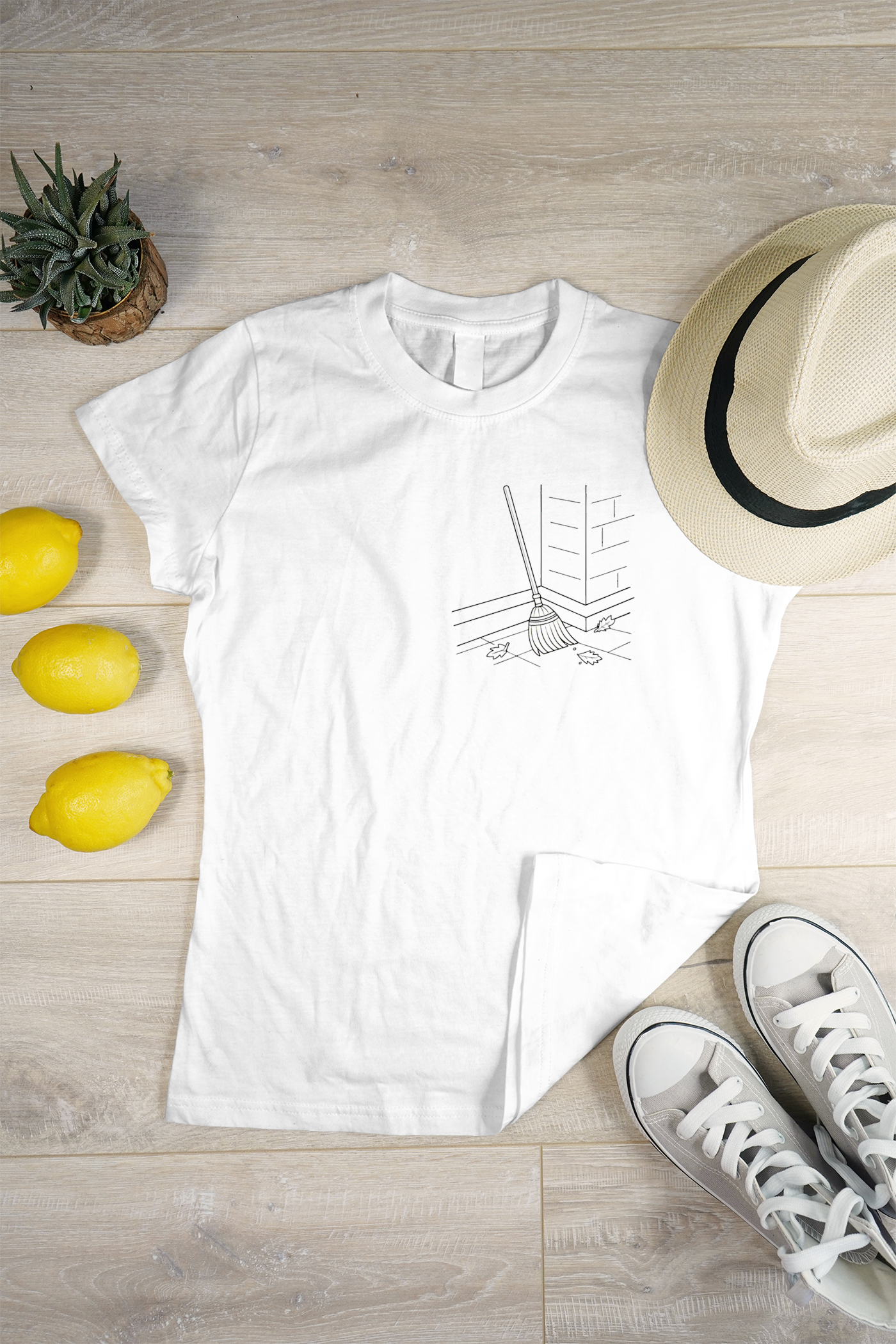 T-shirt automnal avec icône de balai minimaliste pour un look de saison