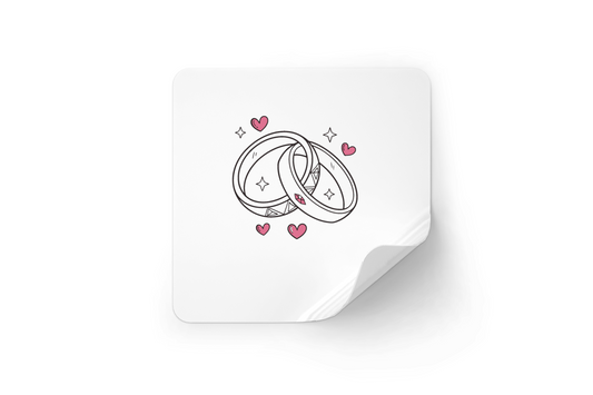 Autocollant anneaux de mariage avec cœurs pour célébration amoureuse.