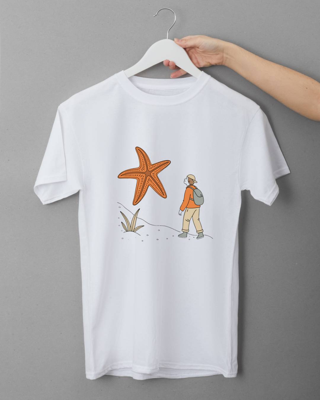 T-shirt avec dessin d'un explorateur et étoile de mer géante dans un style aventure