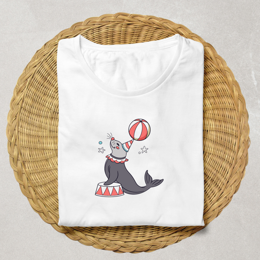 Graphisme adorable de phoque festif jonglant sur un t-shirt tendance et amusant