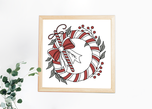 Cadre avec une couronne festive et rayures, ambiance hivernale élégante