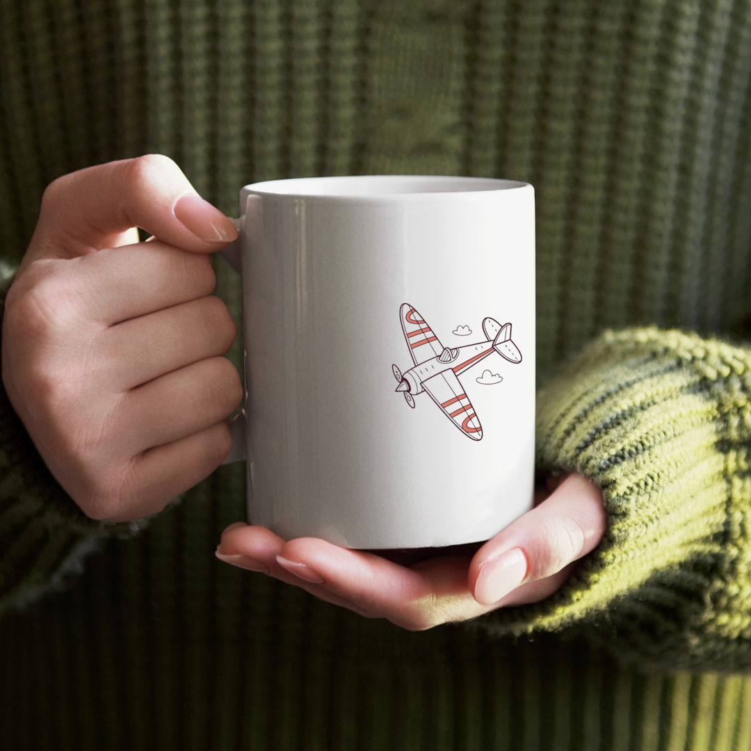 Mug joyeux avec avion multicolore en flat design, ambiance aventure et voyage