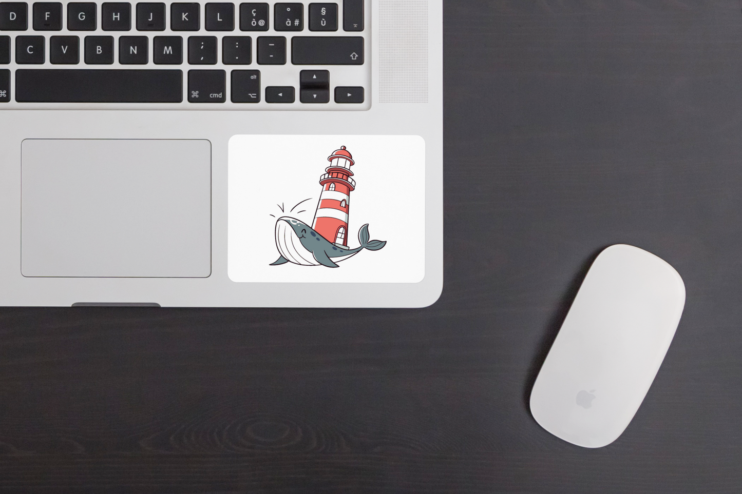 Sticker représentant une baleine joyeuse dans un style pastel devant un phare