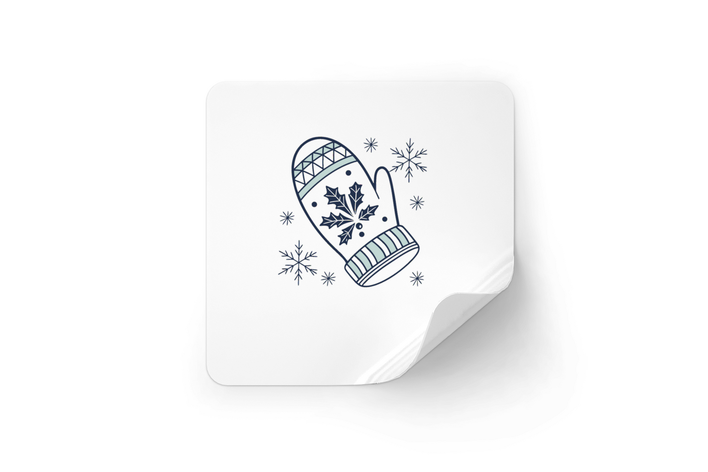 Sticker festif affichant une moufle nordique enneigée sur fond hivernal