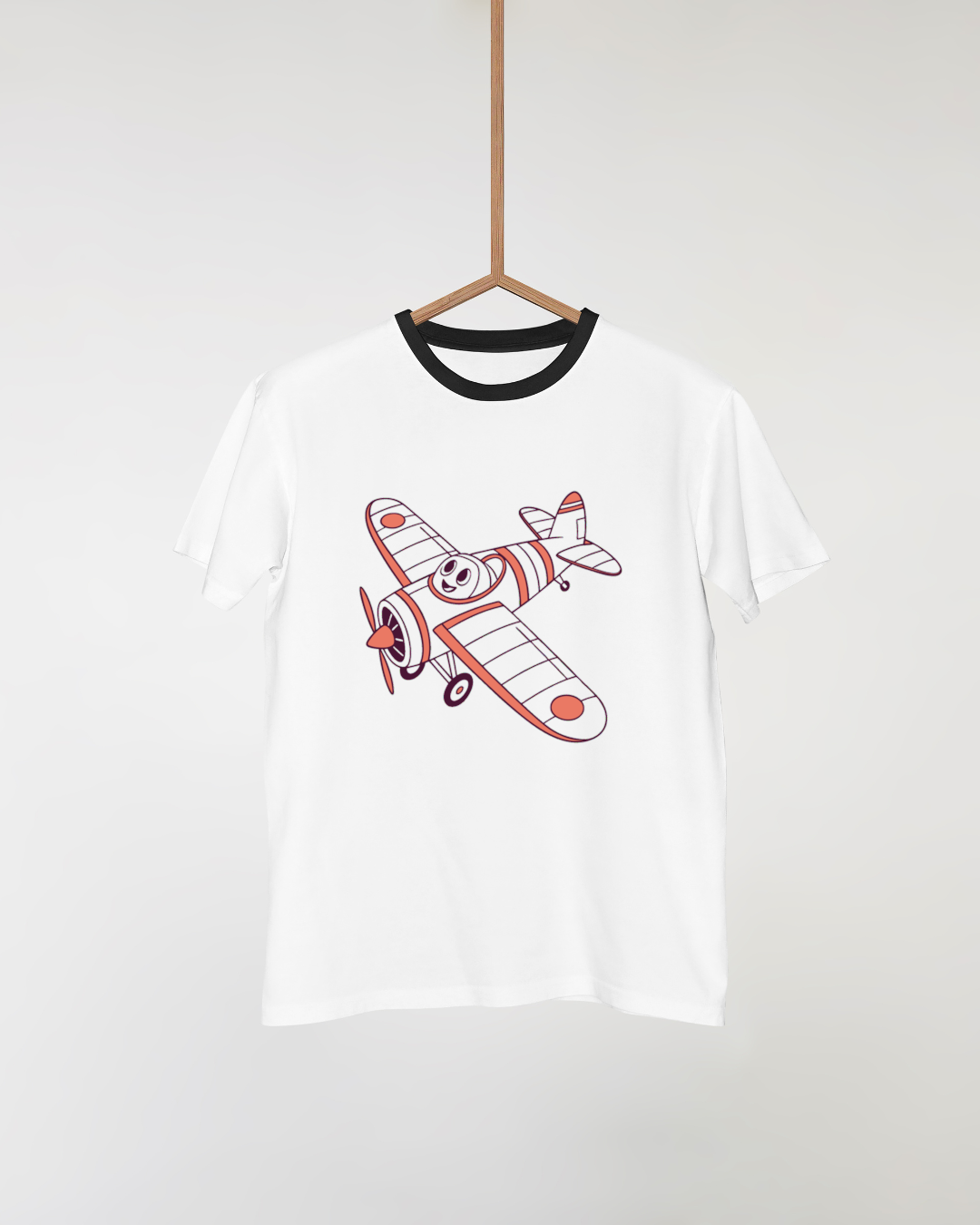 T-shirt orné d'un avion cartoon qui sourit en plein vol pour une touche aventurière