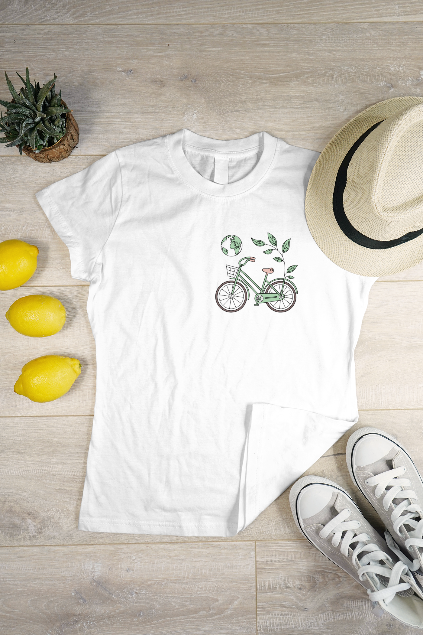 T-shirt avec vélo vert et feuilles, design pastel, esprit écologique dynamique