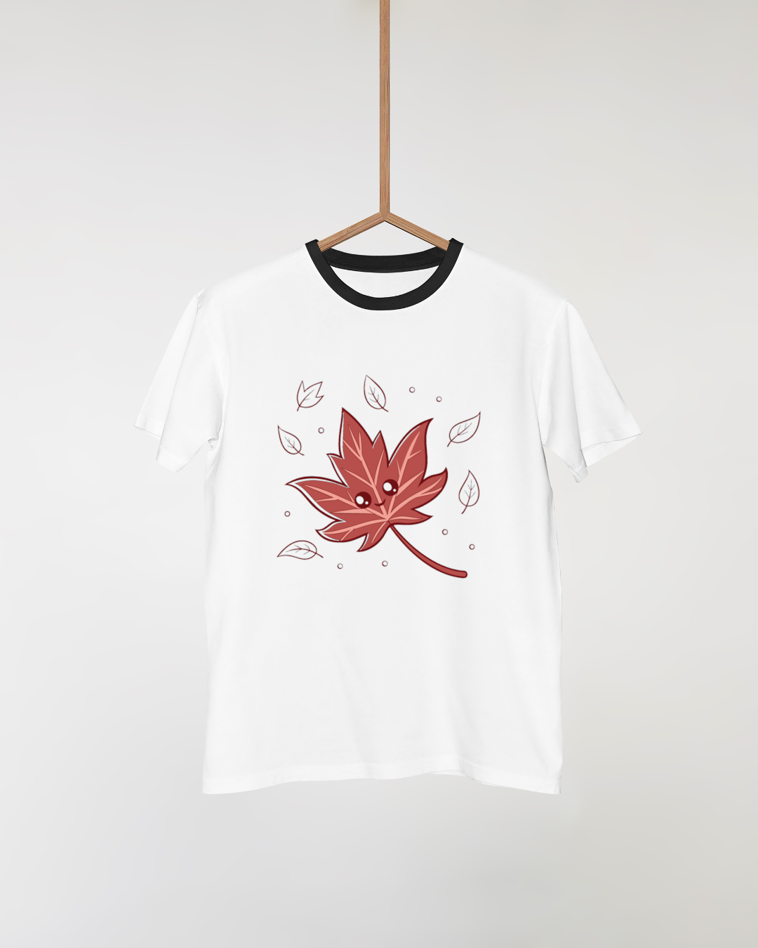 T-shirt cosy avec motif de feuille souriante à l'ambiance automnale