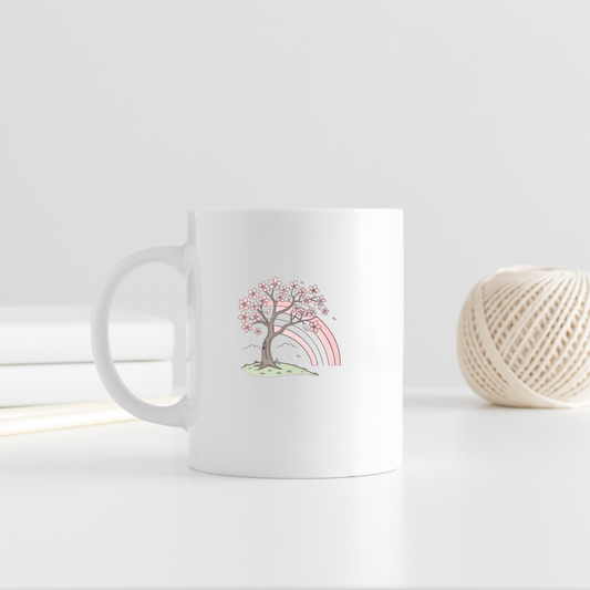 Mug décoré d'une icône pastel de cerisier en fleurs et arc-en-ciel ambiance joyeuse