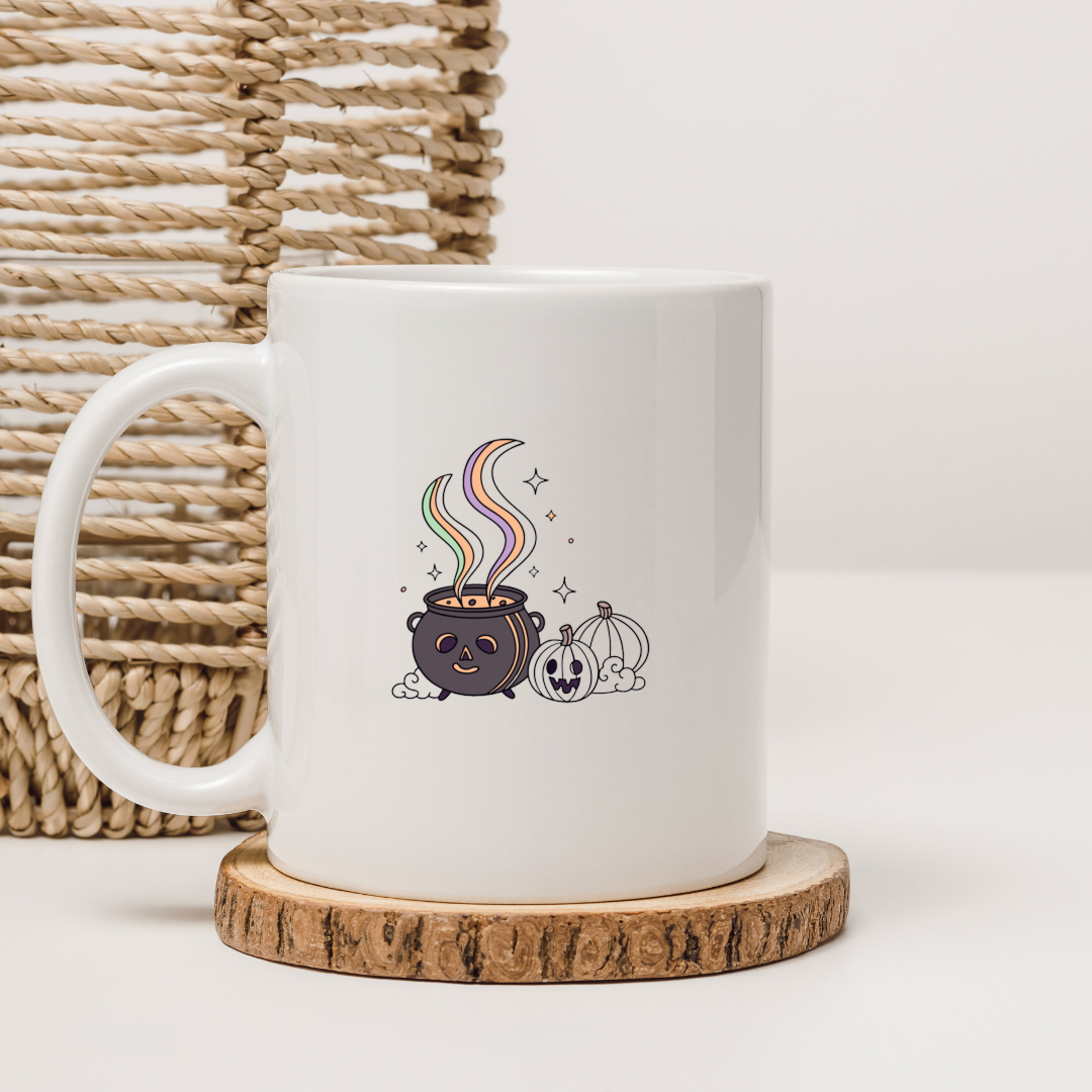 Mug Halloween au design pastel avec un chaudron magique créant une ambiance mystique