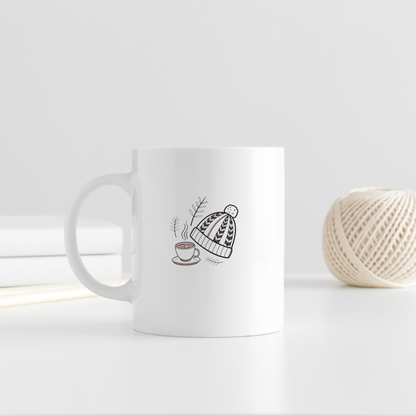 Mug cosy avec motif hivernal minimaliste sur fond chaleureux et épuré