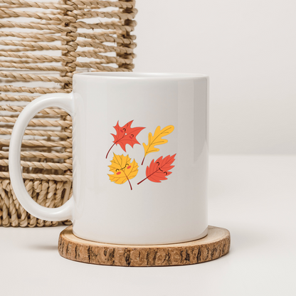 Mug décoré de feuilles joyeuses en tons pastel pour une ambiance automnale ludique