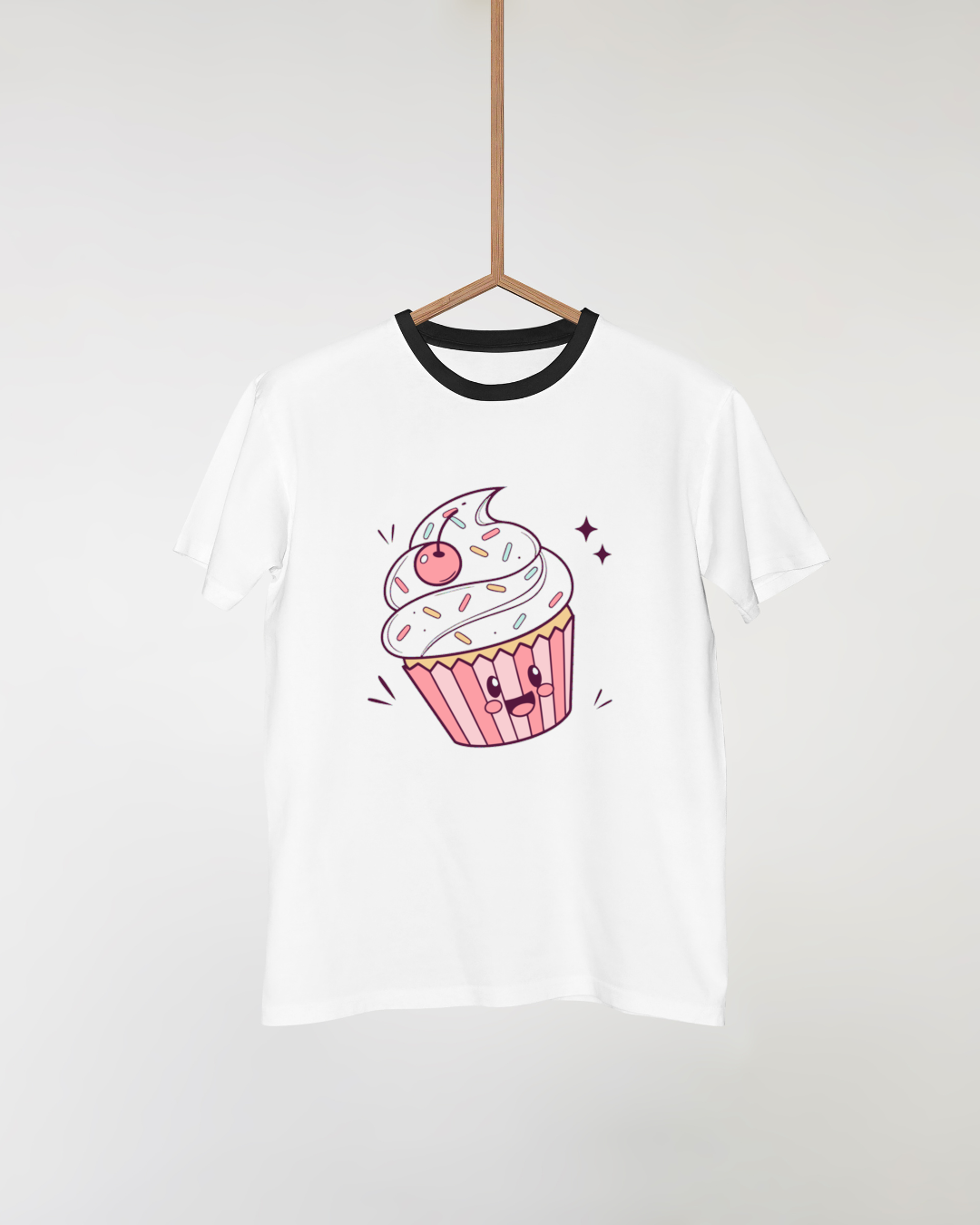 T-shirt avec cupcake kawaii joyeux, parfait pour un look festif.