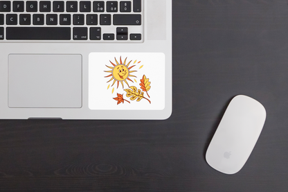 Sticker avec un soleil souriant et feuilles dorées sur fond blanc