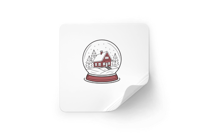 Sticker avec une maison enneigée dans une boule à neige décorative et hivernale