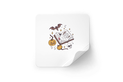 Sticker avec livre mystique entouré de citrouilles pour ambiance Halloween