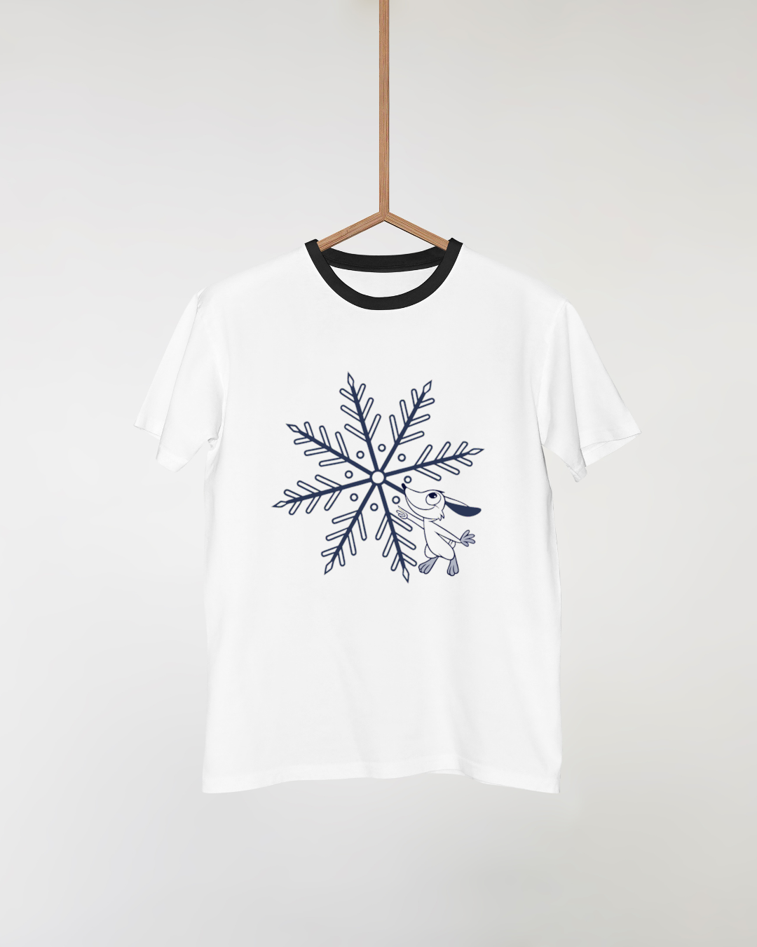 Design hivernal sur t-shirt avec doodle de lapin joyeux et flocons gracieux