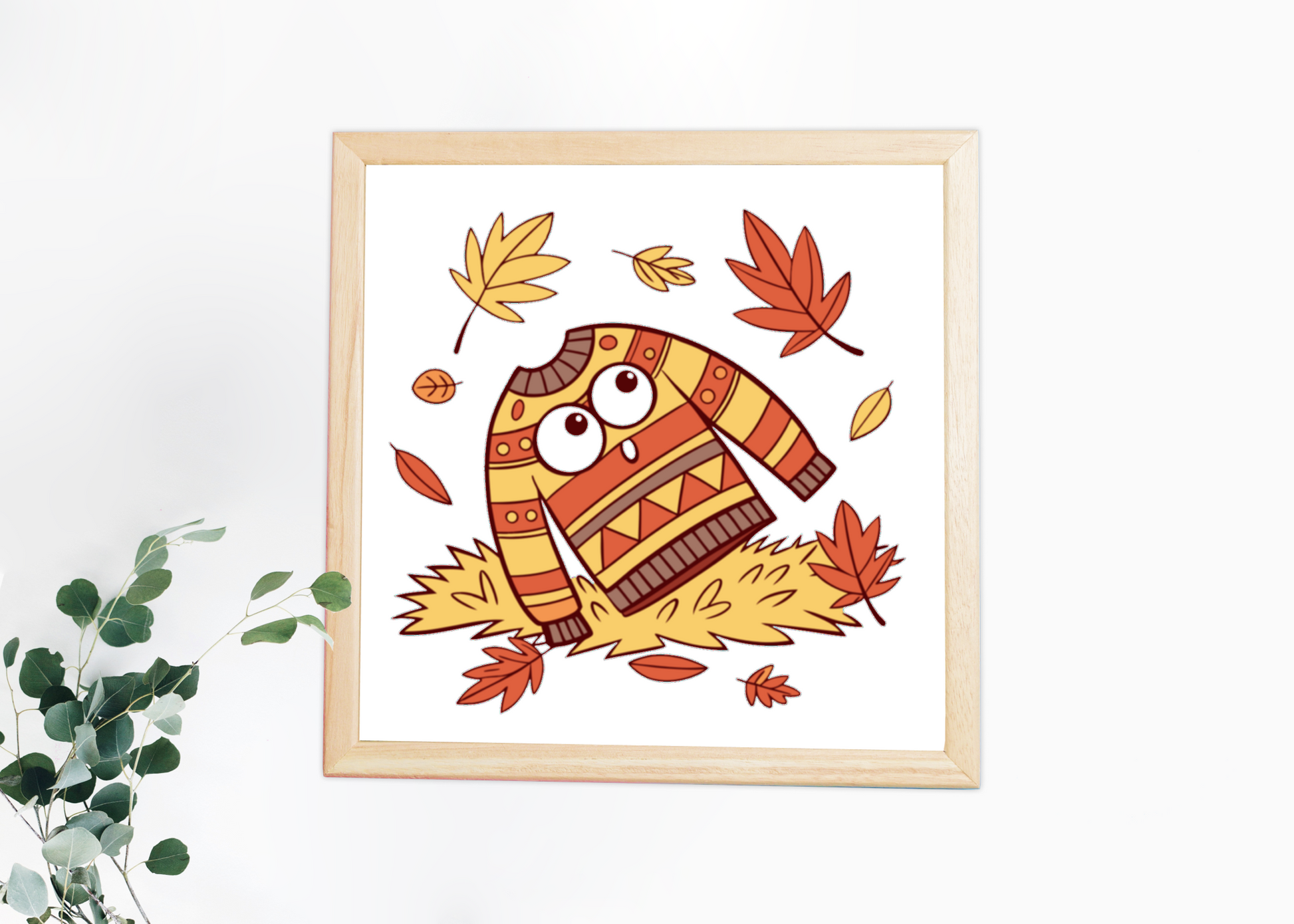 Cadre déco automne avec icône pull et feuilles volant doucement