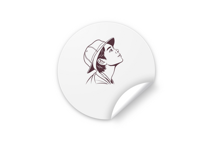 Sticker vibrant illustrant un garçon émerveillé avec un chapeau, style aventureux