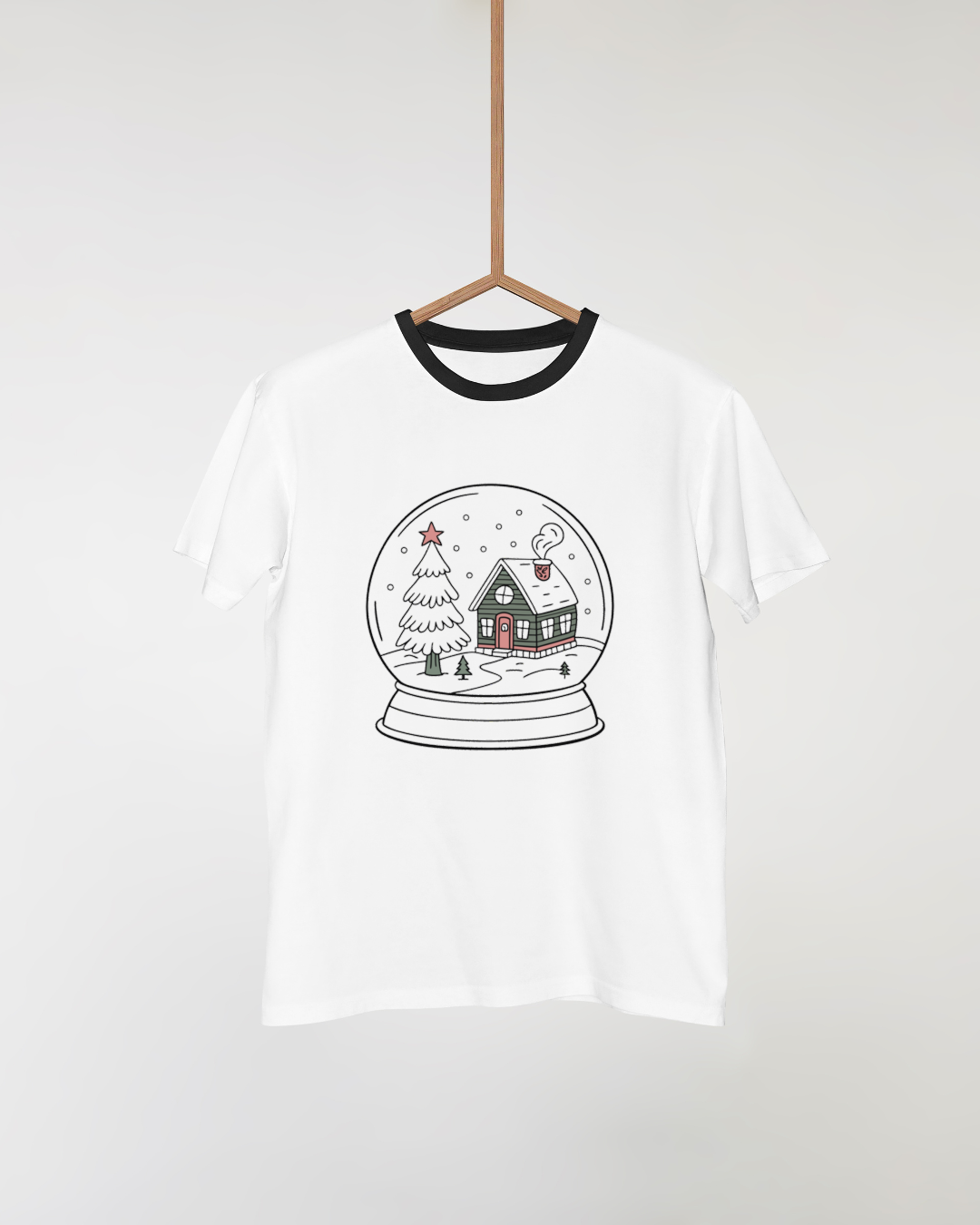 T-shirt avec design féérique de maison hivernale sous globe pour une ambiance festive
