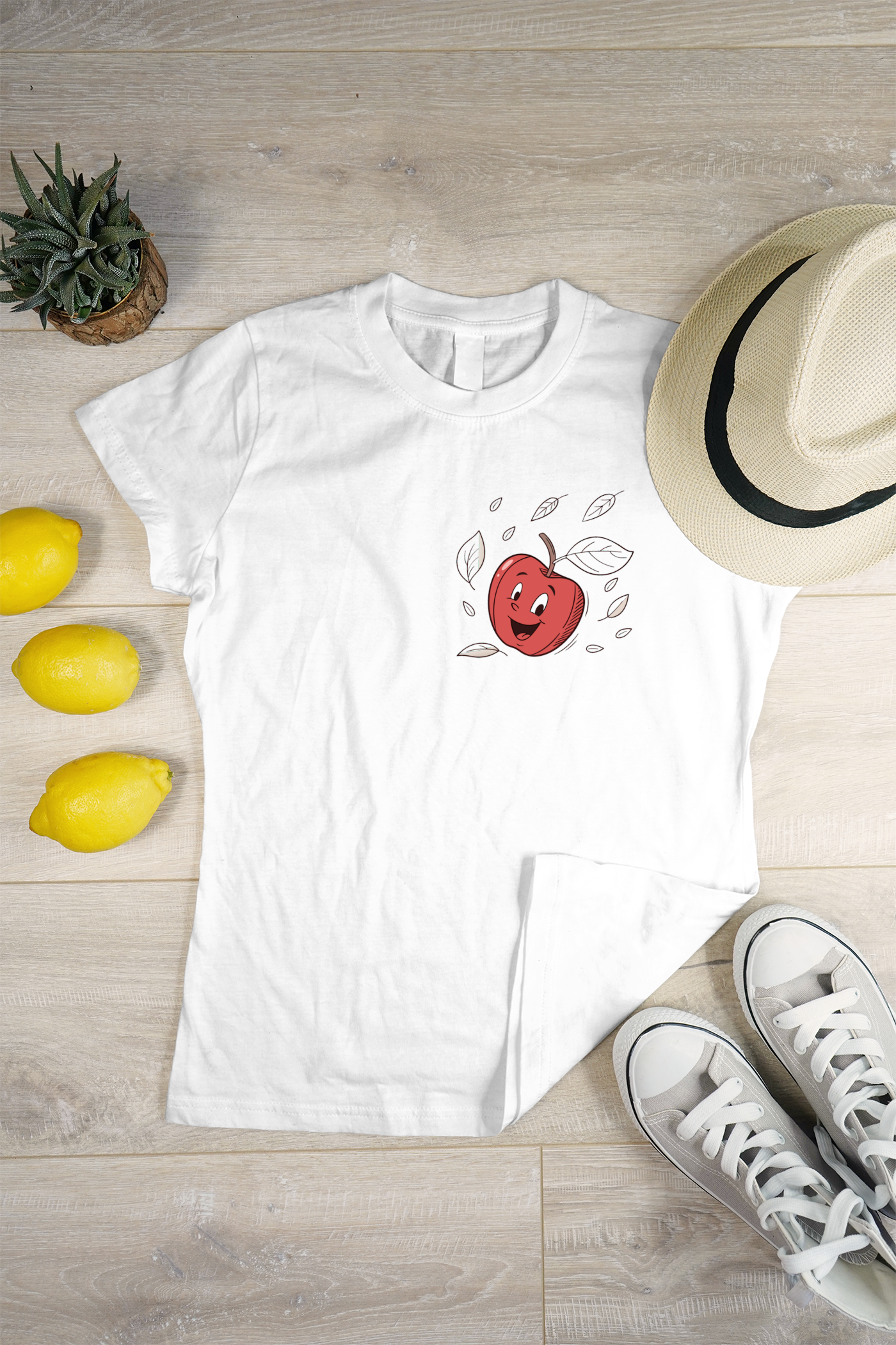 T-shirt affichant une pomme joyeuse en vol dans un style cartoon coloré
