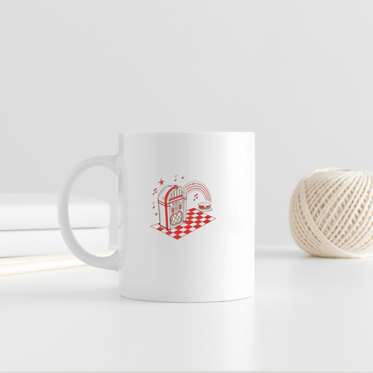 Design jukebox rétro sur mug, idéal pour fan de musique vintage