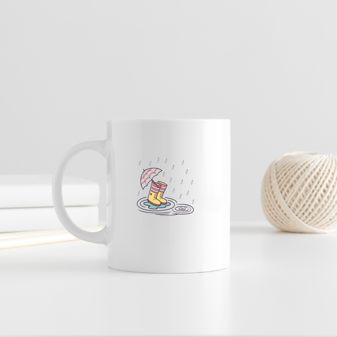 Mug décoré de bottes et parapluie style doodle évoquant une journée pluvieuse