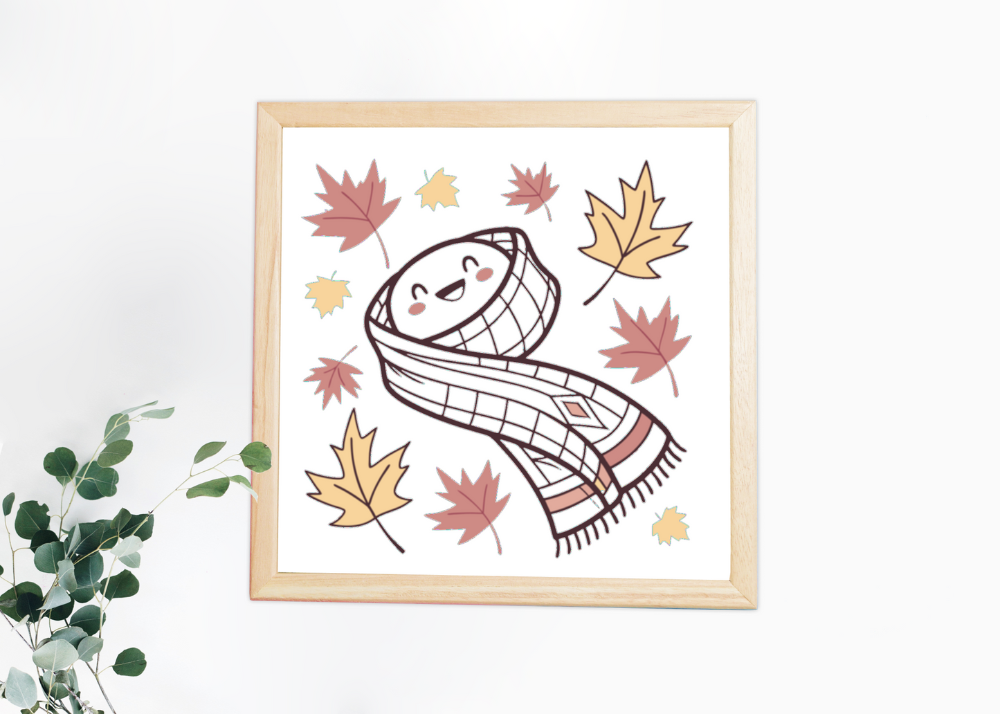 Cadre décoratif automnal avec icône numérique festive sous des feuilles vibrantes