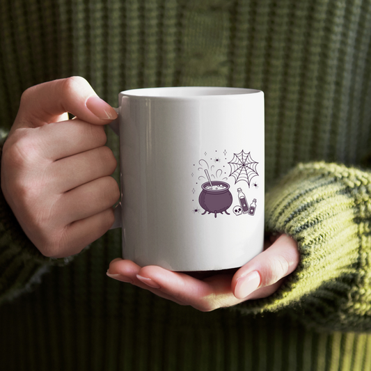 Mug décoré avec chaudron fumant dans un style Halloween enchanteur