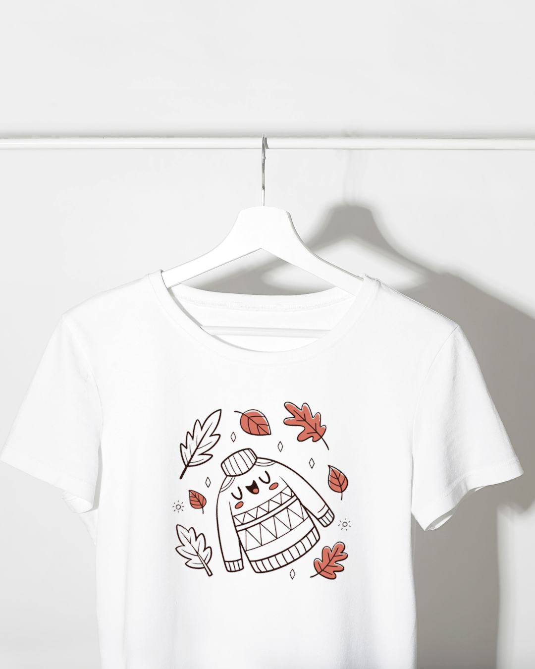 T-shirt avec joueurs et feuilles tourbillonnantes en pastel pour ambiance automnale