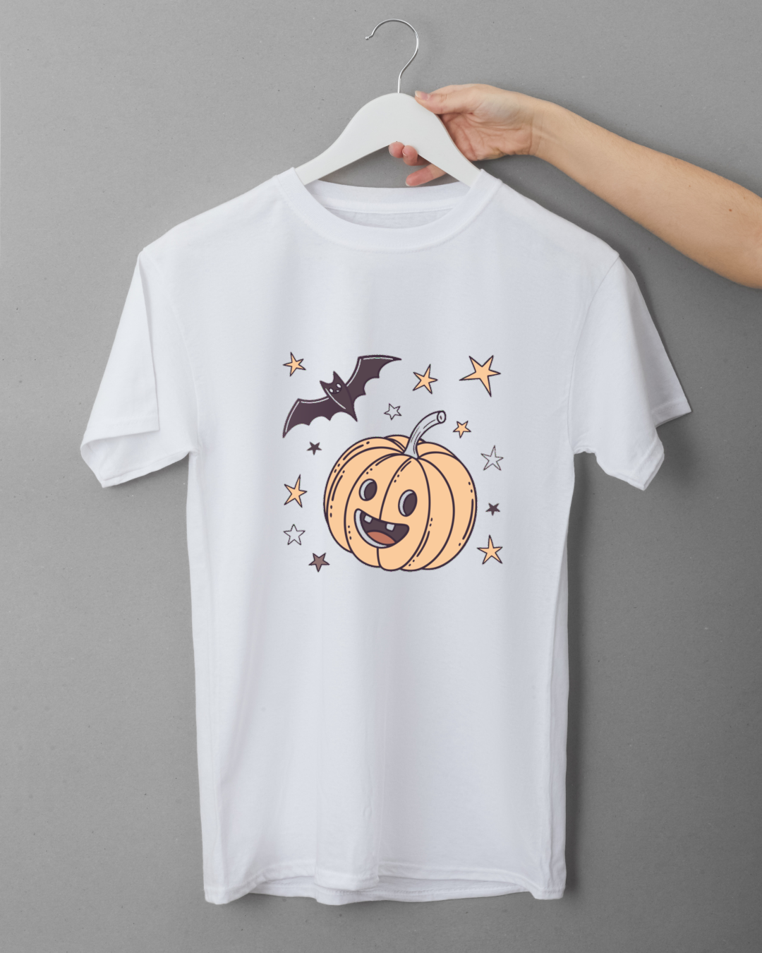 T-shirt avec citrouille souriante et étoiles pour un Halloween ludique