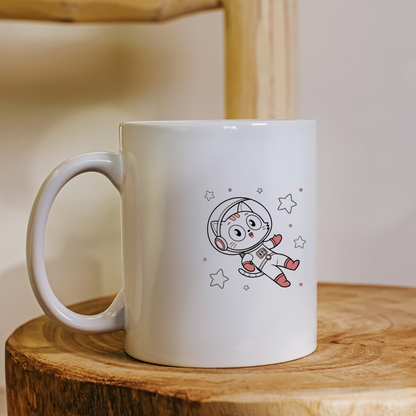 Mug coloré avec un chat astronaute kawaii explorant l'espace sur fond étoilé