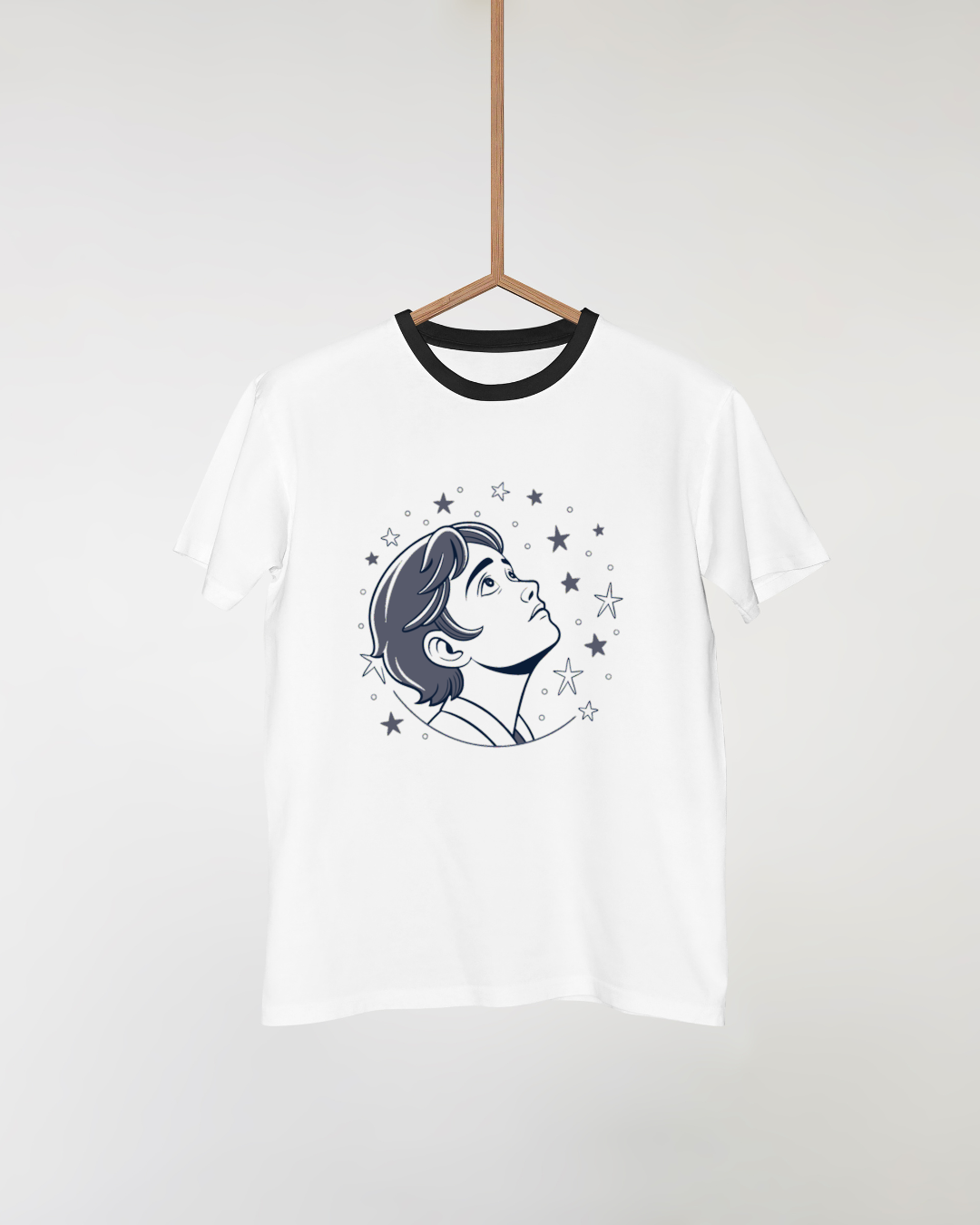T-shirt graphique avec garçon contemplatif regardant étoiles dans style cosmique
