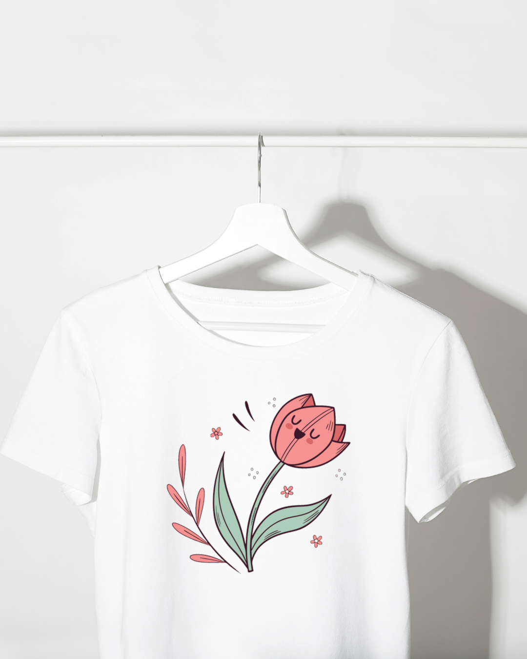 Design pastel numérique de fleur sur t-shirt évoquant la joie printanière