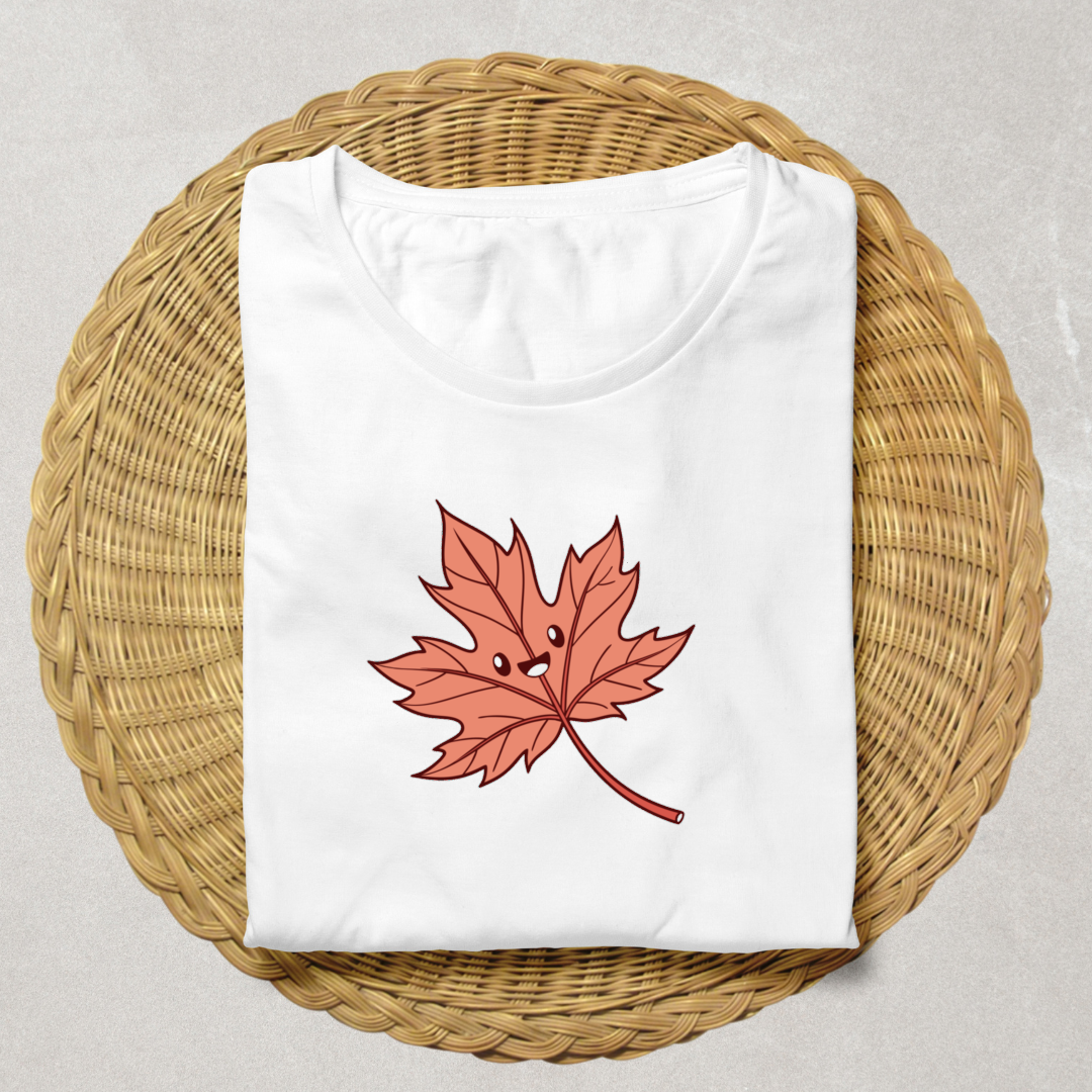 T-shirt orné d'une feuille d'automne souriante style kawaii, ambiance festive automnale
