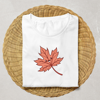 T-shirt orné d'une feuille d'automne souriante style kawaii, ambiance festive automnale
