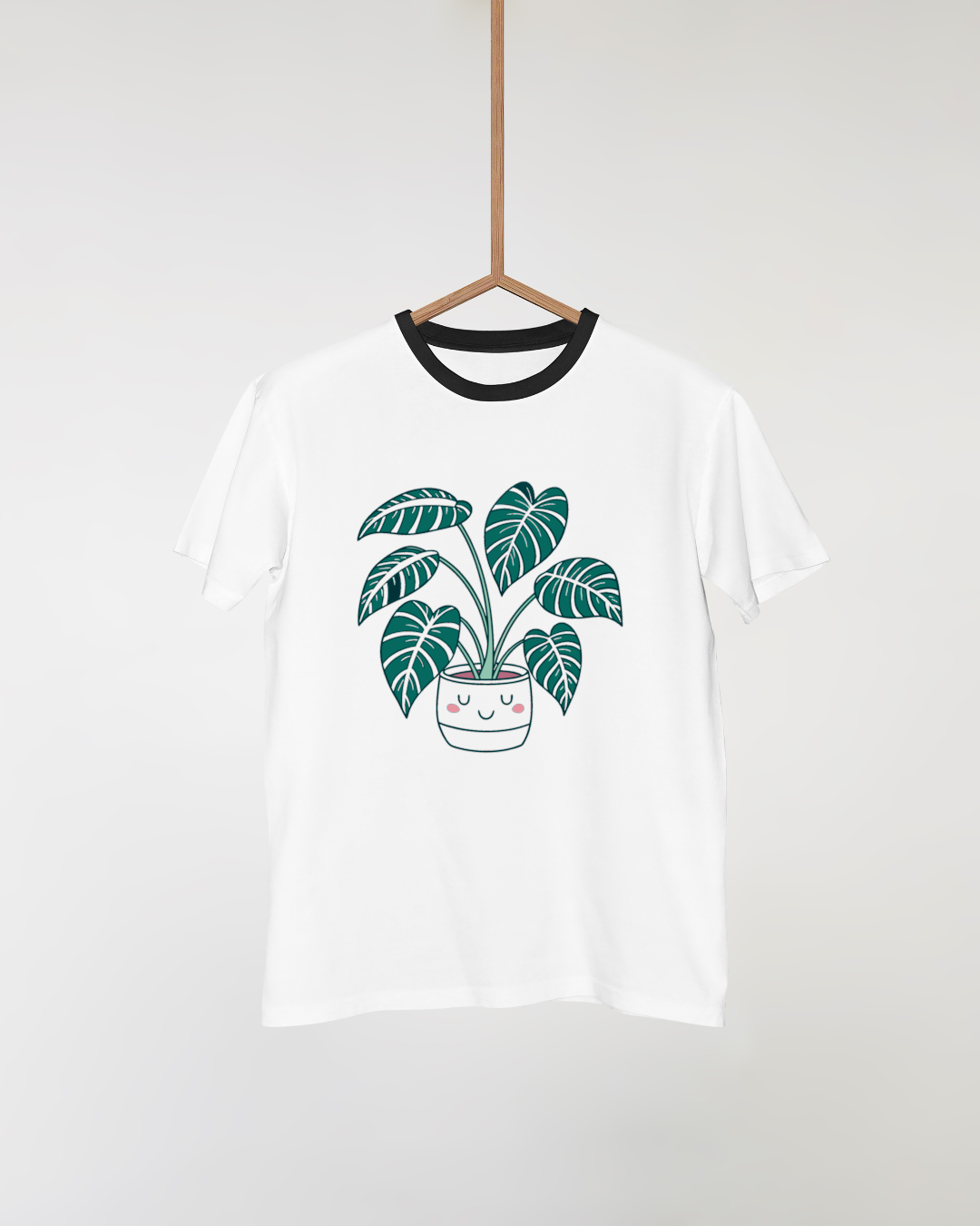 T-shirt cartoon avec plante souriante en pot mignon et décor naturel