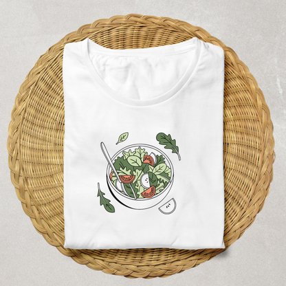 T-shirt blanc avec design salade minimaliste dans une ambiance cuisine gourmande