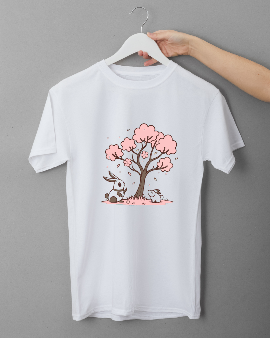 T-shirt kawaii avec lapins sous cerisier en fleur pour célébrer le printemps