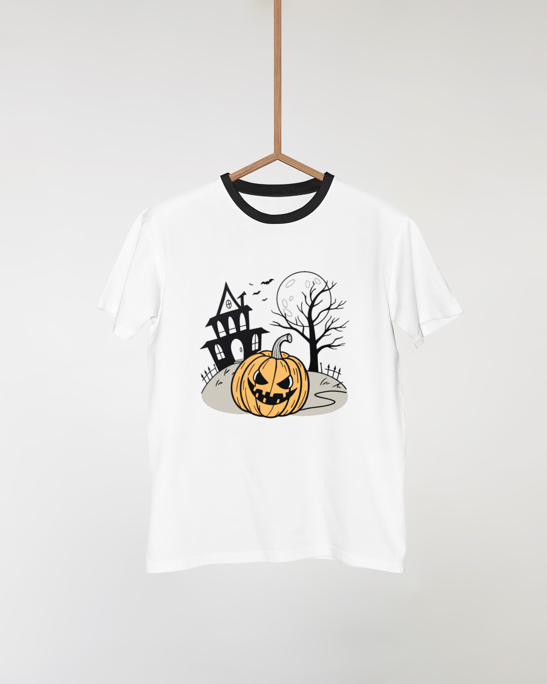 T-shirt Halloween avec citrouille menaçante devant un manoir sombre