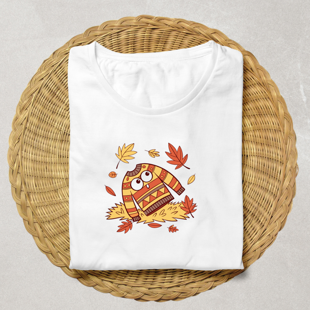 T-shirt automnal cosy avec pull effrayé et feuilles volantes