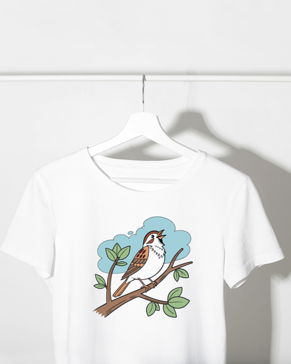 T-shirt avec moineau délicatement illustré posant sur une branche style vectoriel doux