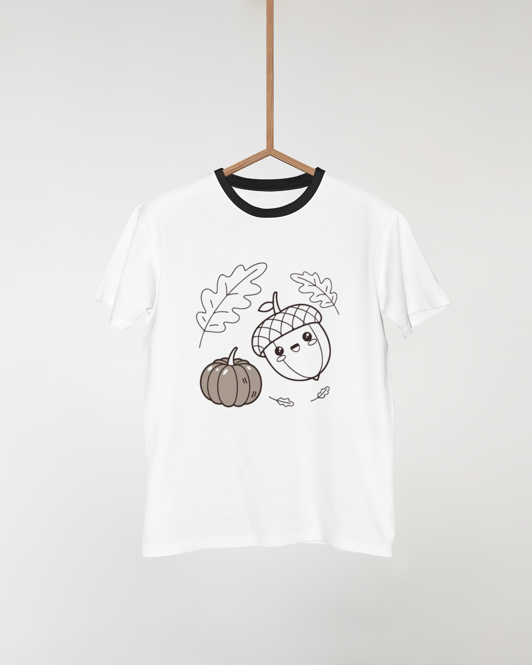 T-shirt automnal avec un gland souriant et une citrouille dans un style adorable