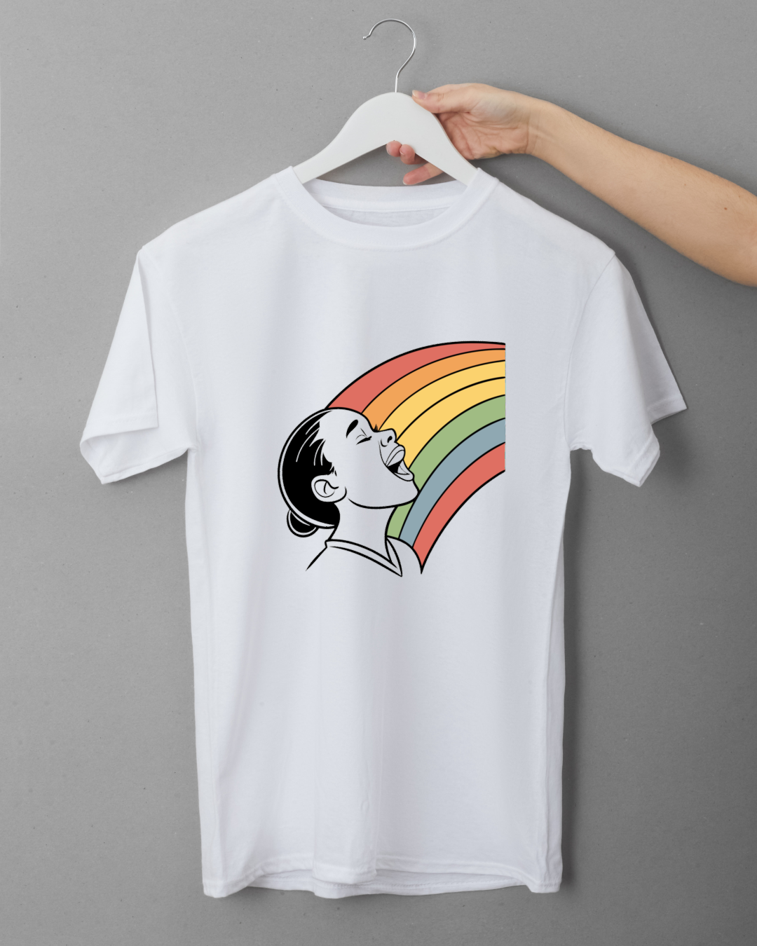 T-shirt avec design d'enfant joyeux sous un arc-en-ciel, ambiance vive et colorée