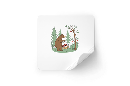 Sticker affichant un ours mignon récoltant des fruits dans une forêt magique