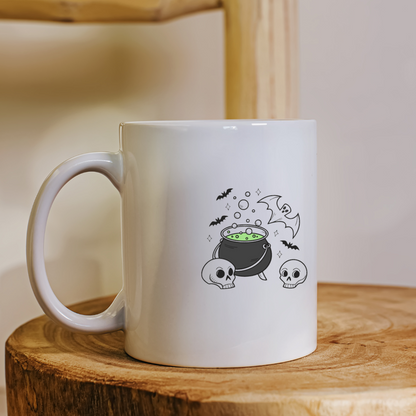 Mug décoré avec un chaudron bouillonnant et une chauve-souris effrayante en noir et blanc